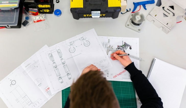 person holding white printer paper